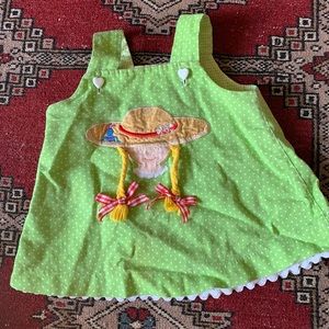 Adorable child’s dress with pigtailed girl